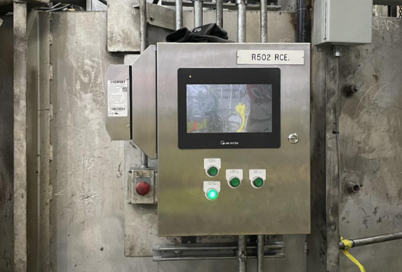 rotary furnace modernized controls on control panel mounted to the wall